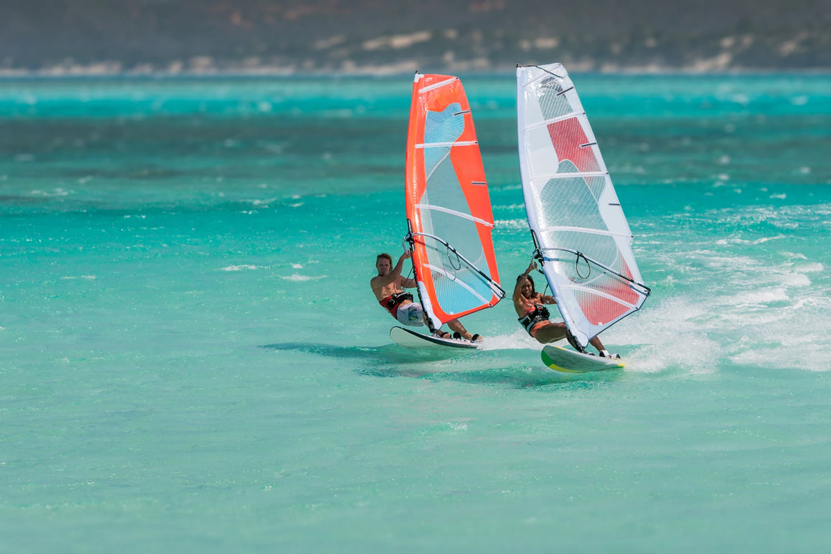 Two windsurfers planing in the footstraps